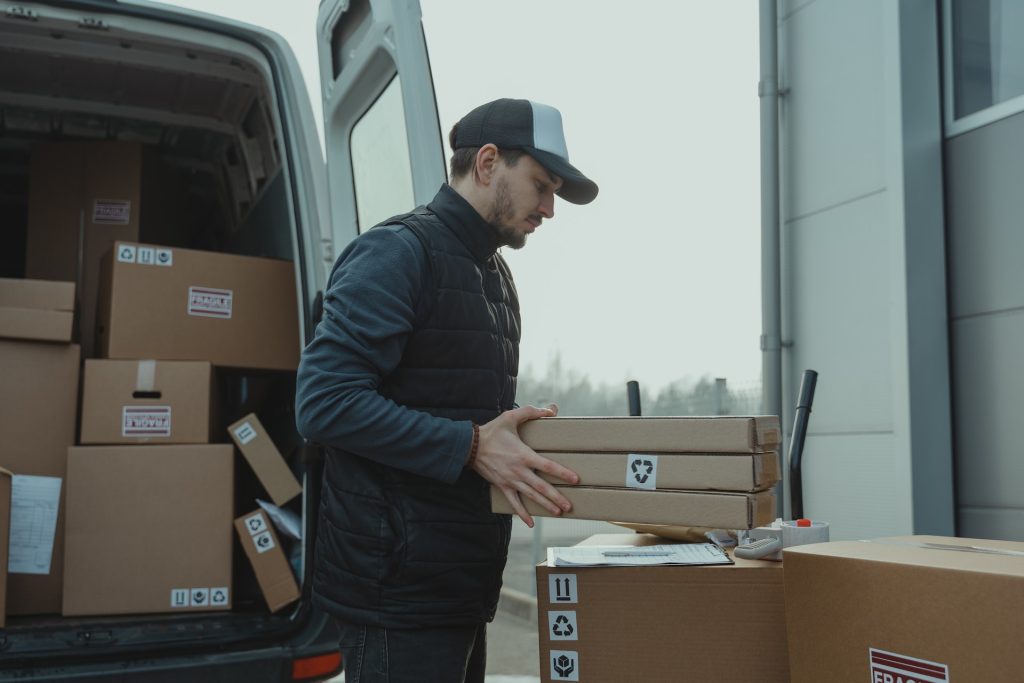 Image of a man packing his products for Amazon FBA